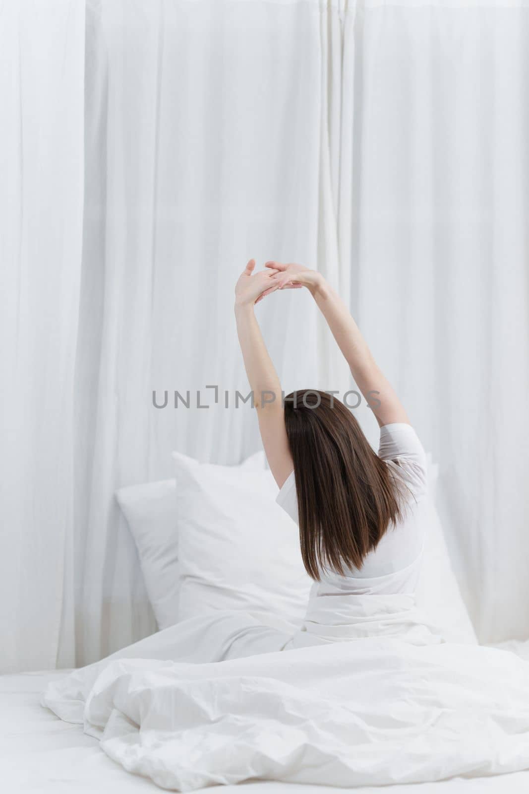 Image of beautiful young woman resting in bed at bedroom. Lifestyle at home concept
