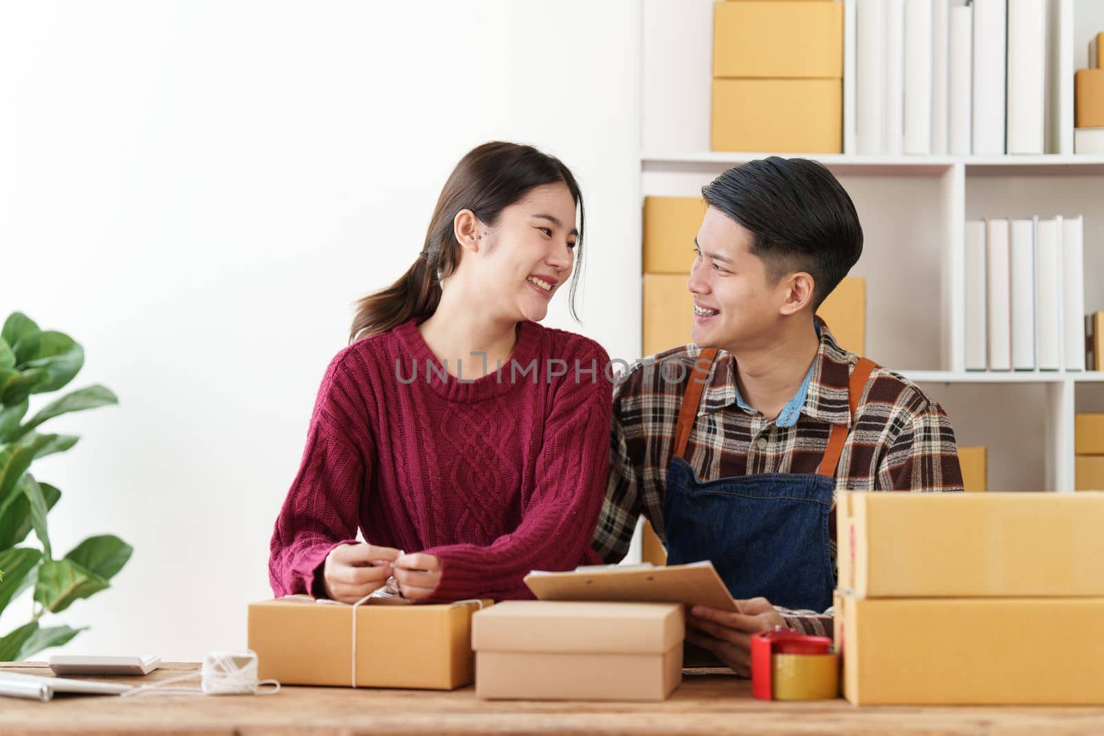 Asian couple doing business online. Entrepreneurs, small SME businesses concept