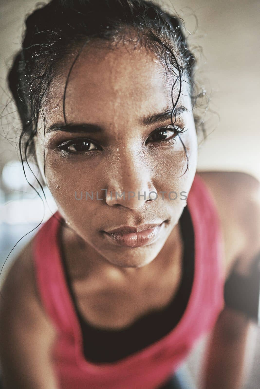 Be stronger than your excuses. Portrait of a sporty young woman exercising outdoors