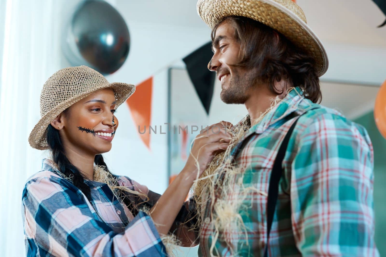Youre a needle in a haystack. a young couple getting dressed for halloween at home