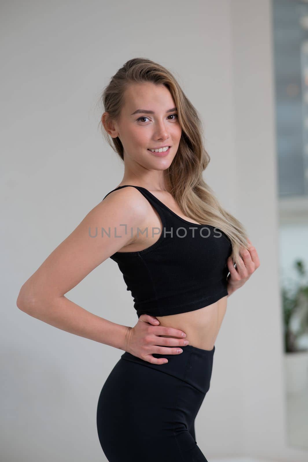 Portrait of a beautiful caucasian woman in black sportswear