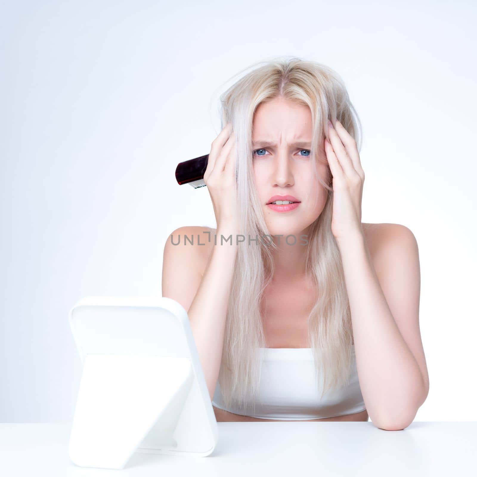 Personable beauty fresh clean skin woman having dry hair problem. Frustrated facial expression concept of damaged hair loss for shampoo ads in copyspace isolated background.