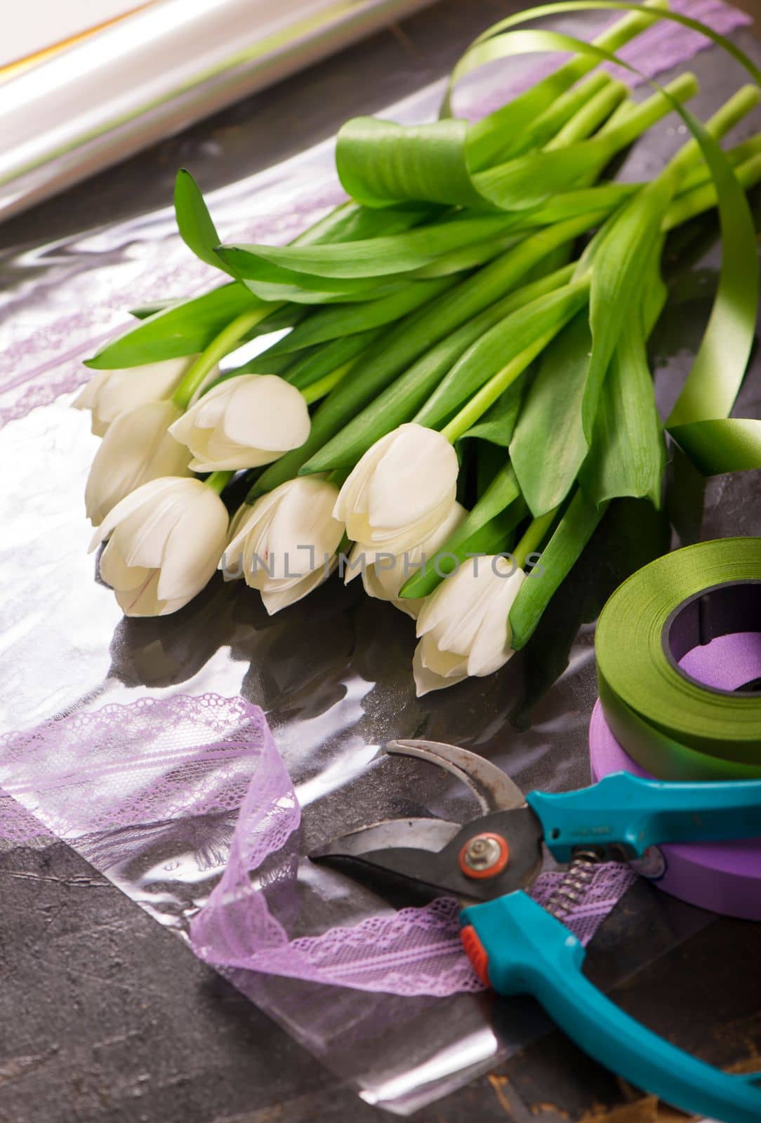 image of holiday gift packaging. sale and packaging of flowers. Bouquet of white tulips by aprilphoto