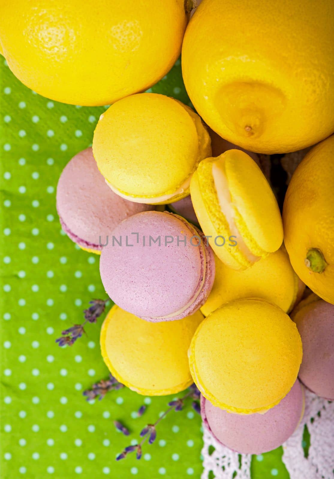 Sweet macaroons on a green napkin, vintage color tone by aprilphoto