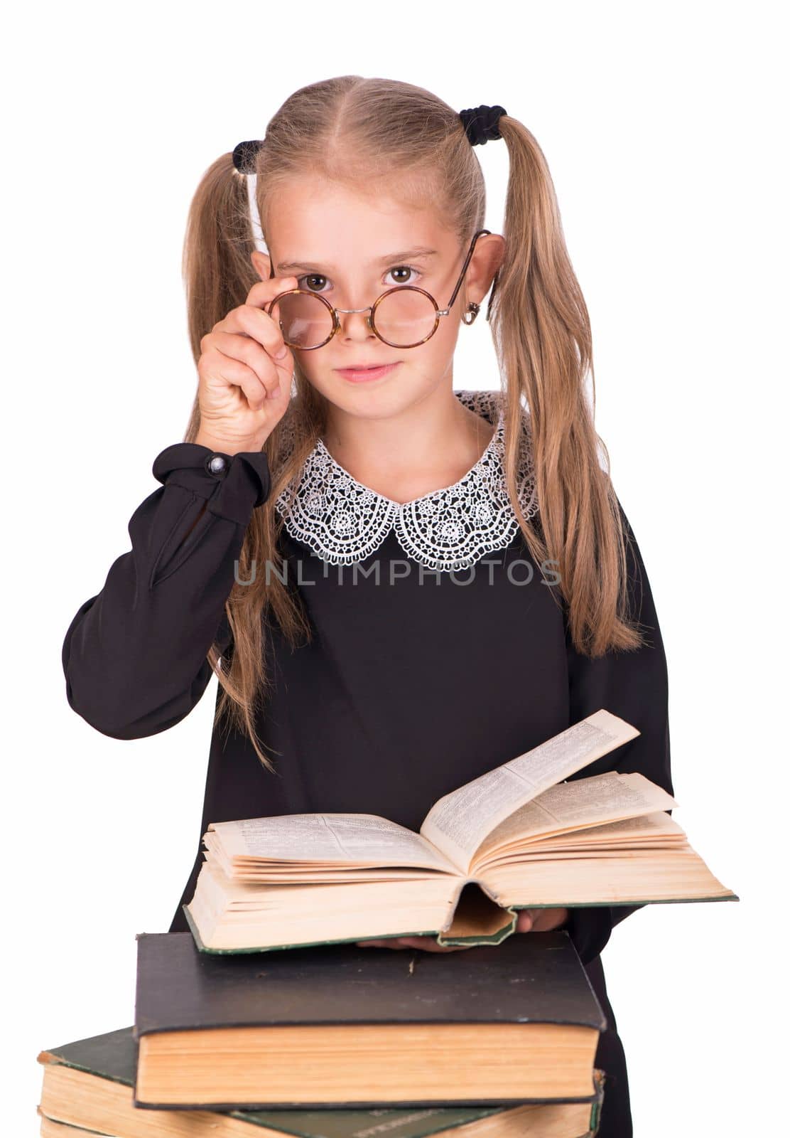 schoolgirl with books and school supplies isolated on white background.