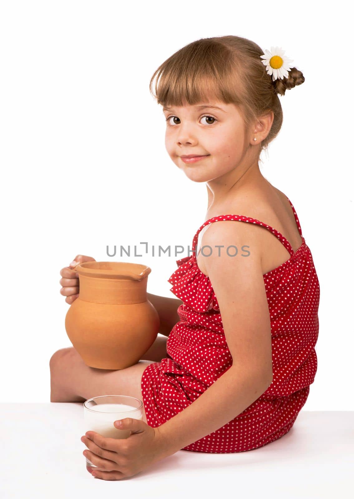 Little girl and milk. Little cute girl holding clay jug with milk isolated on the white background by aprilphoto
