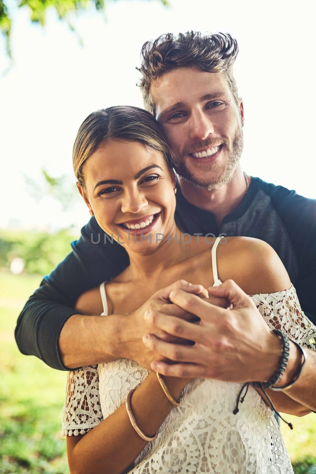 Together forever and ever. Portrait of a young couple bonding together outdoors