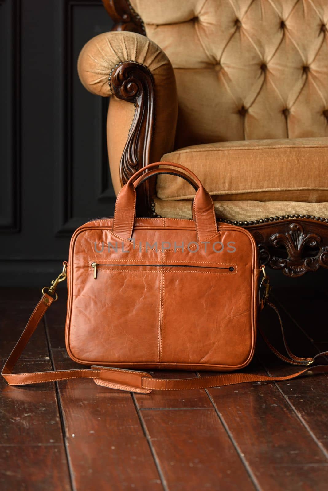 close-up photo of orange leather bag corporate. Indoor photo