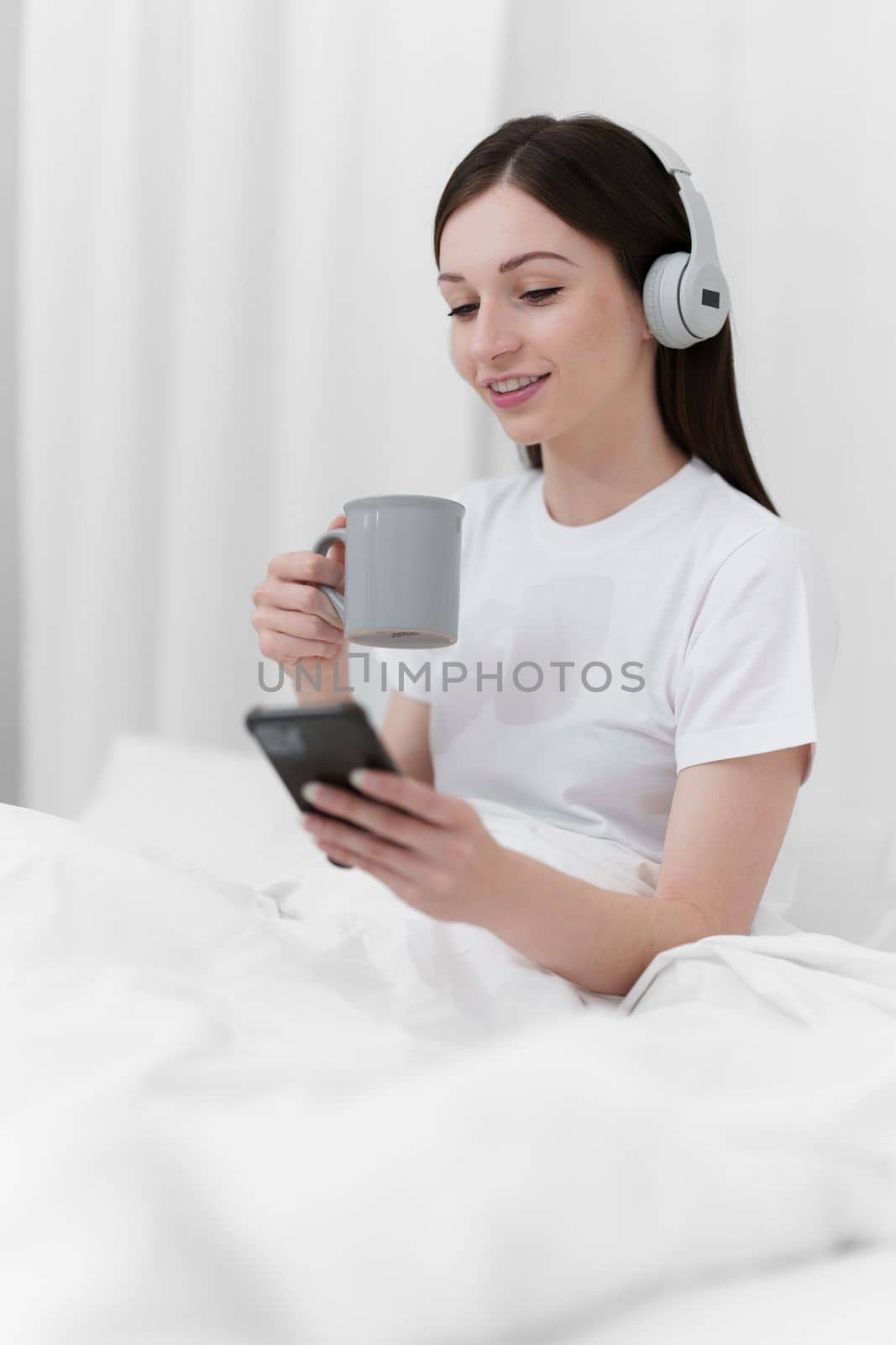 Portrait of Good Healthy woman drinking tea and resting in bed at bedroom. Lifestyle at home concept.