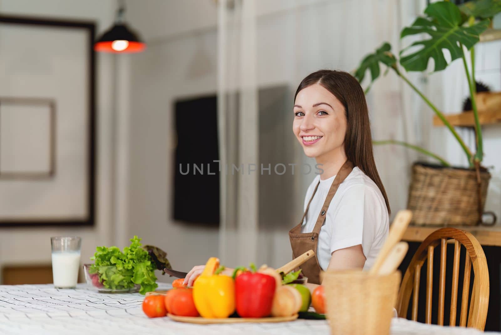 Young Healthy woman cooking healthy food in the kitchen at home. Healthy lifestyle, food, diet concept