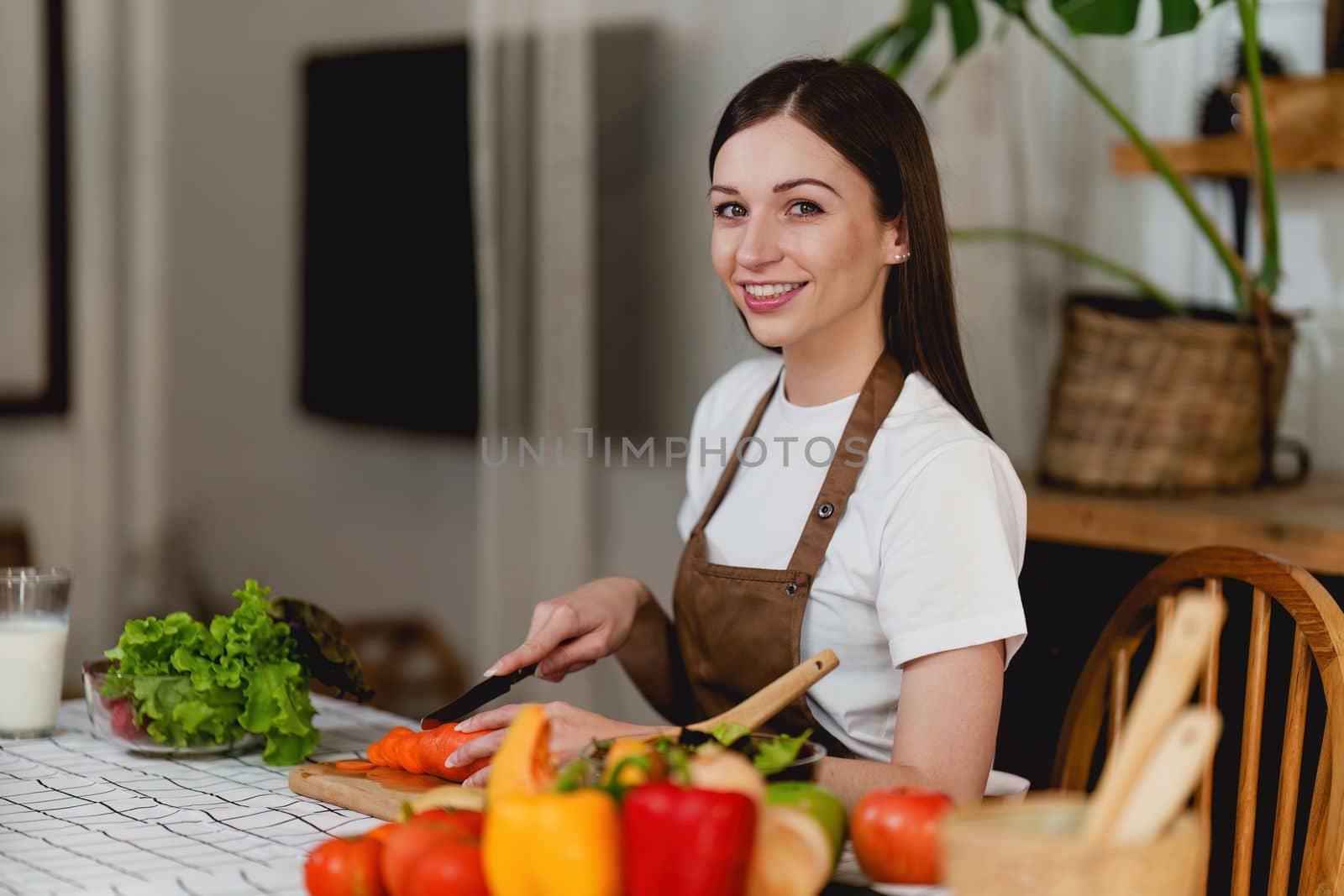 Young Healthy woman cooking healthy food in the kitchen at home. Healthy lifestyle, food, diet concept
