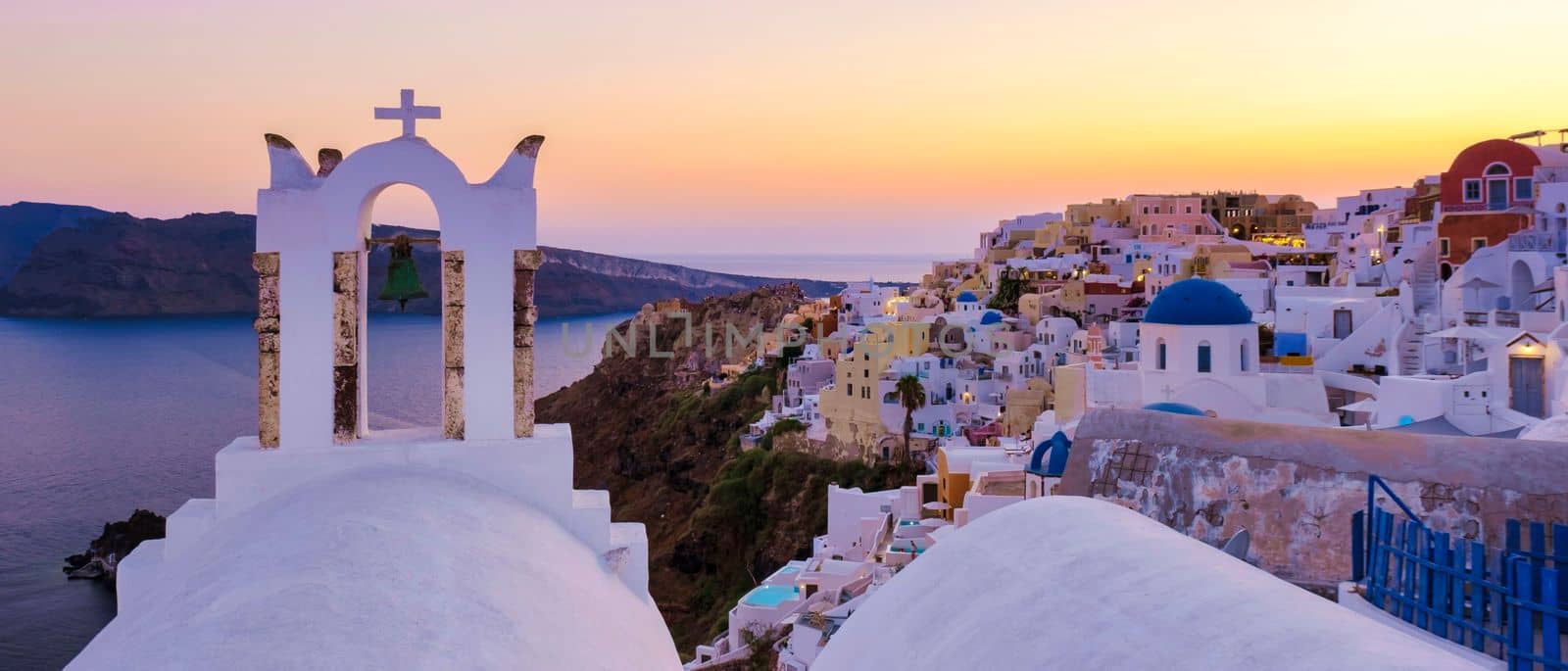 Sunset at the Greek village of Oia Santorini Greece with a view over the ocean caldera of Santorini