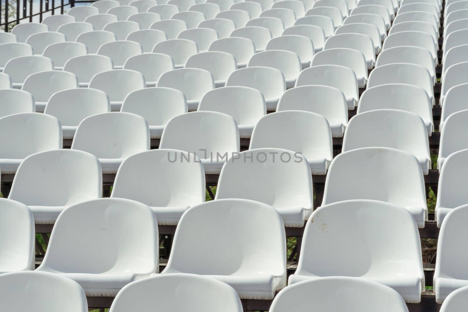 Seats of tribune on sport stadium. Concept of fans, chairs for audience, cultural environment concept. mpty seats, modern stadium. by Matiunina