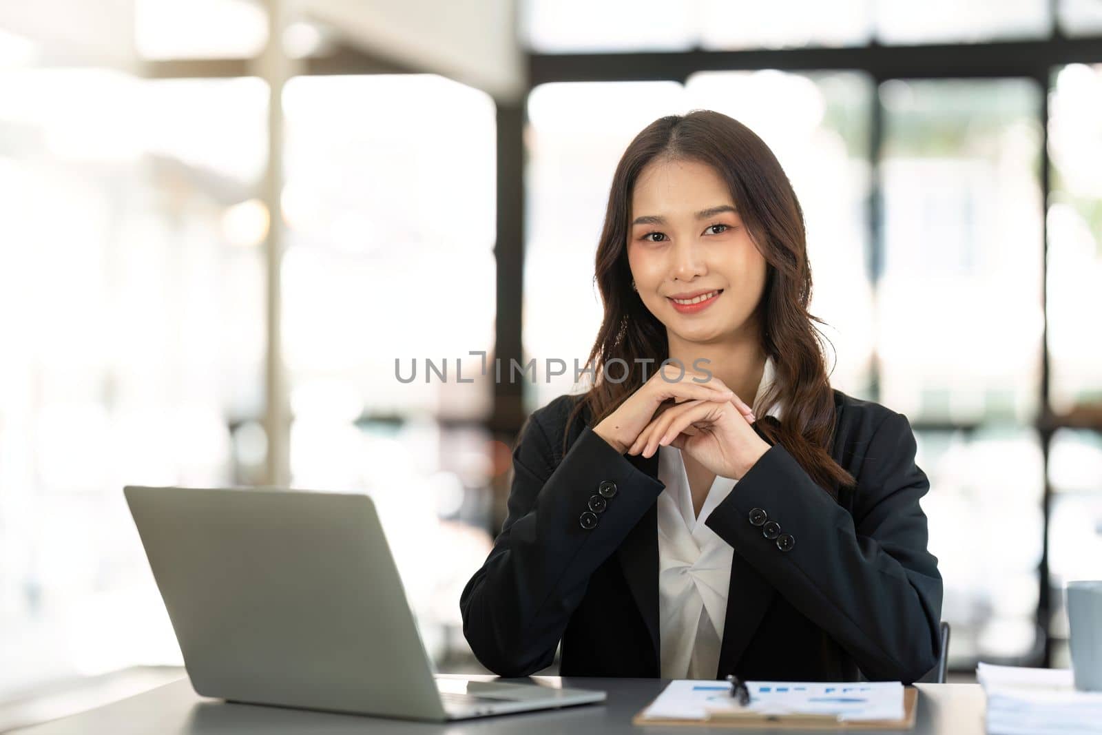 Businesswoman sitting at her desk in an office.
