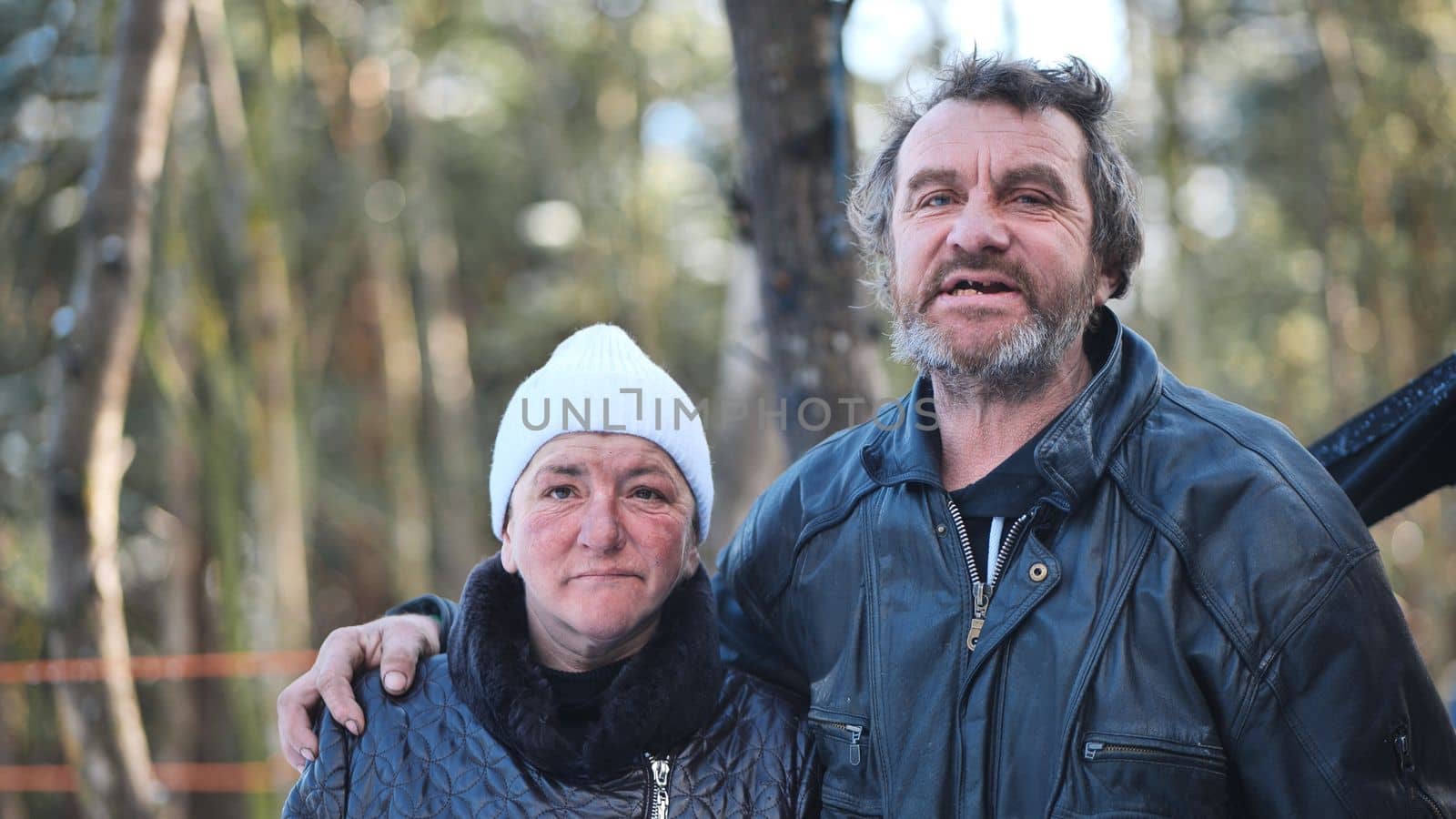 Homeless people are interviewed in the winter in the woods