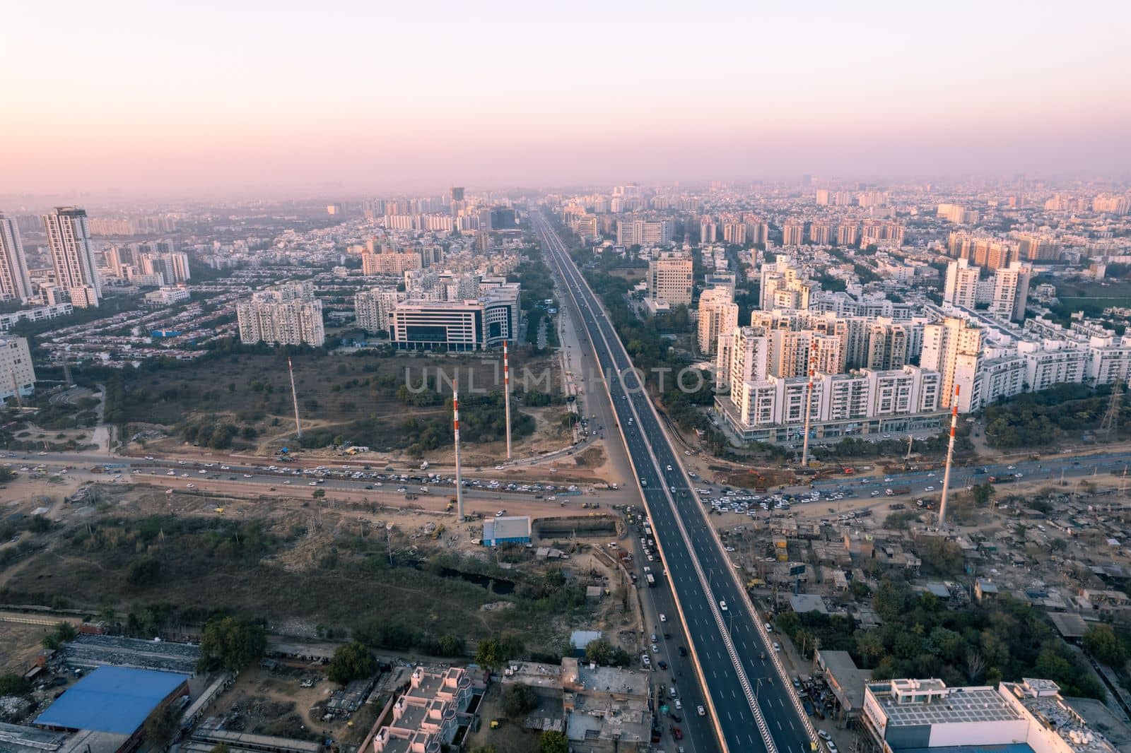 aerial drone still shot showing busy sohna elevated highway toll road with traffic stuck at interesction due to road construction of bridge or underpass by Shalinimathur