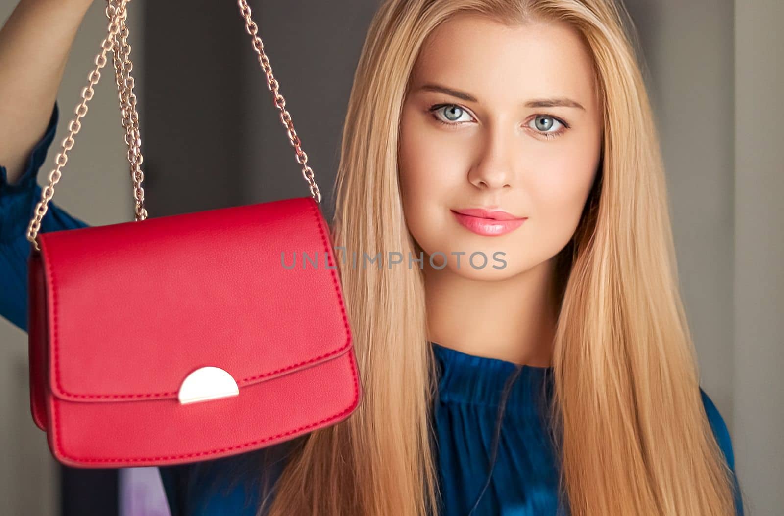 Fashion and accessories, happy beautiful woman holding small red handbag with golden details as stylish accessory and luxury shopping concept