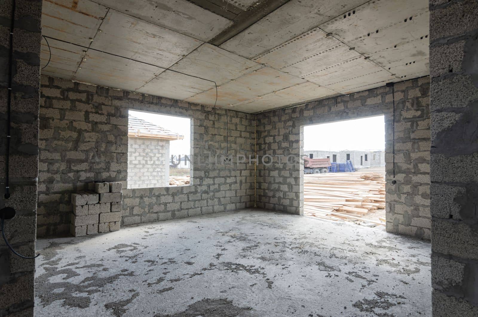 Construction of an individual residential building, view of a large spacious room with stained glass windows a