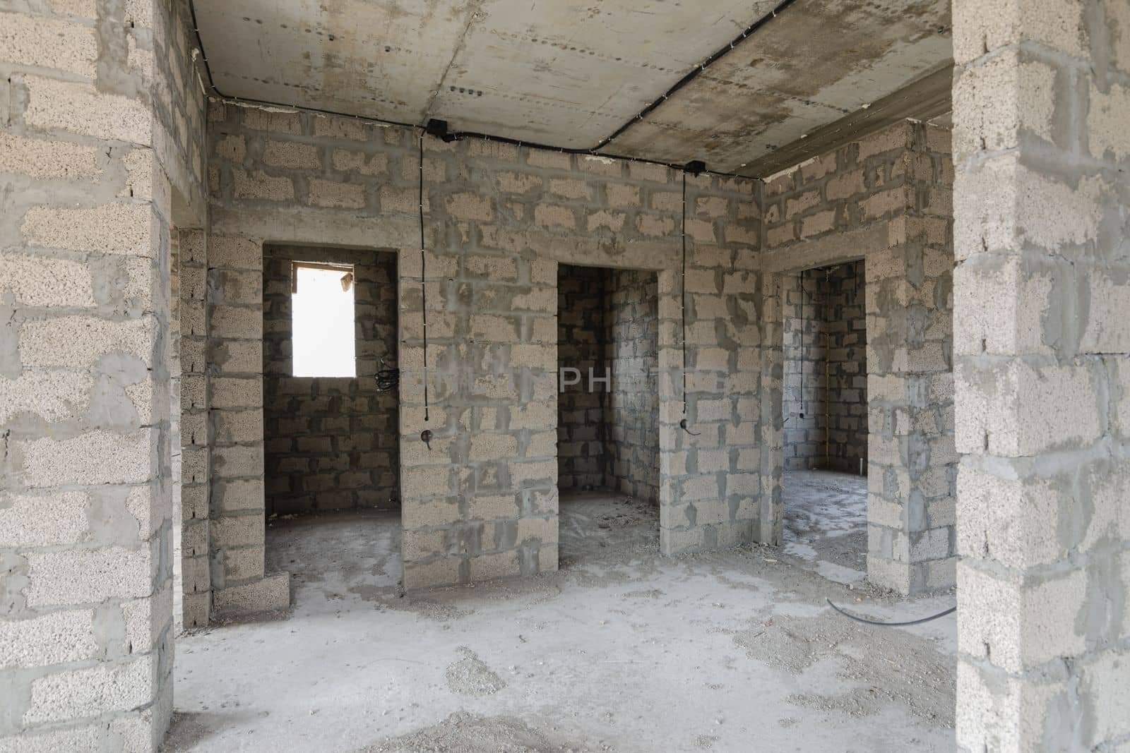 Construction of an individual residential building, view of the doorways to the bathrooms and rooms by Madhourse