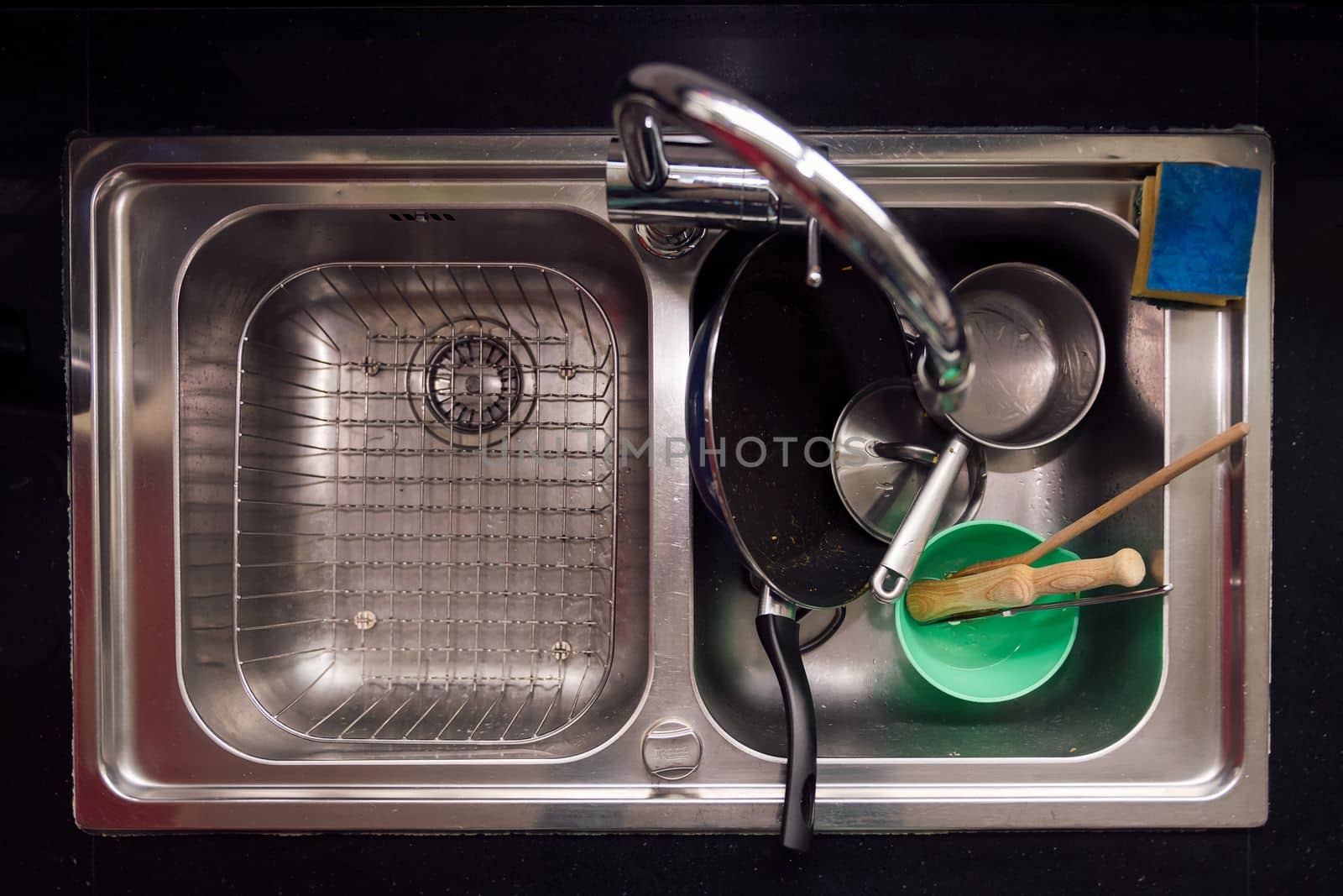 top view of a sink with dirty dishes, concept of cleaning at home and in the kitchen