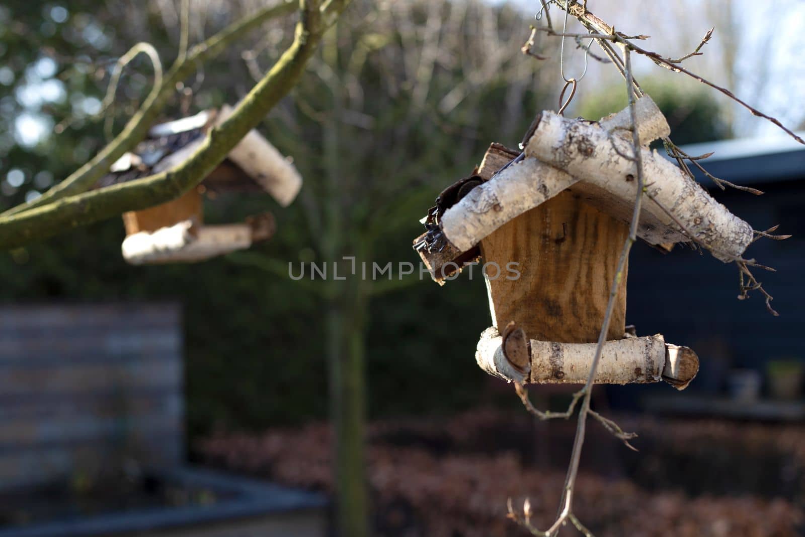 wooden birdhouse for birds on a tree in the Park,garden close-up handmade house for birds in nature forest, spring concept close up