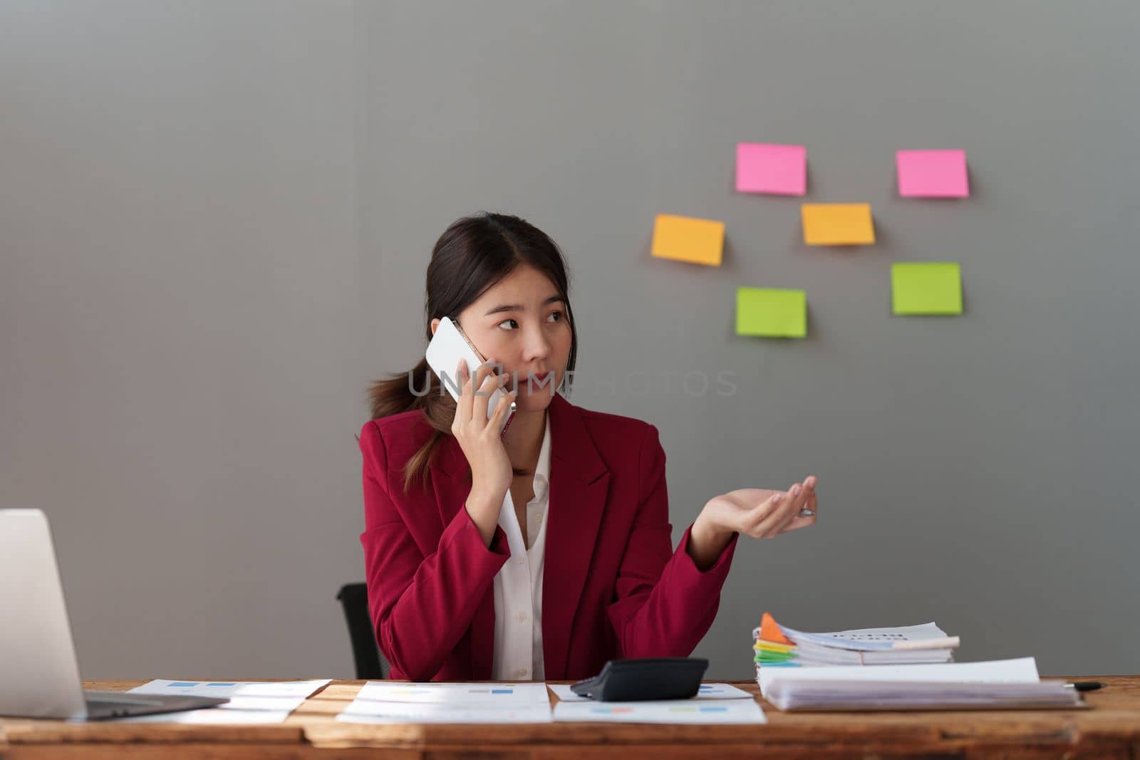 Beautiful business woman talking on the mobile phone. Management, planning and networking phone call concept. by itchaznong