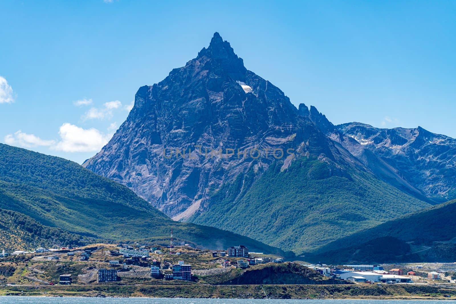 Buildings of the city of Ushuaia in Patagonia Argentina under the snow mountains