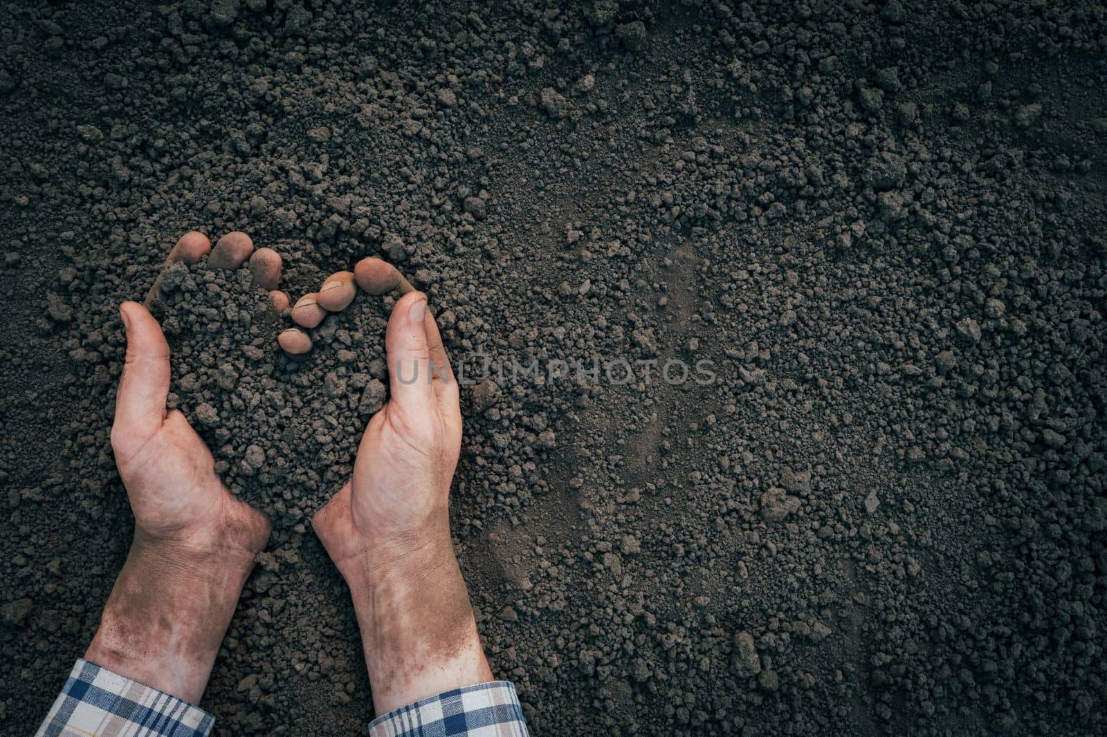 Handful of dirt hands heart shape. Agriculture symbol heart earth day. Male hands full of soil earth save environment day. Farmer hands soil ground earth dirt garden soil farm ground. Fertile ground by synel