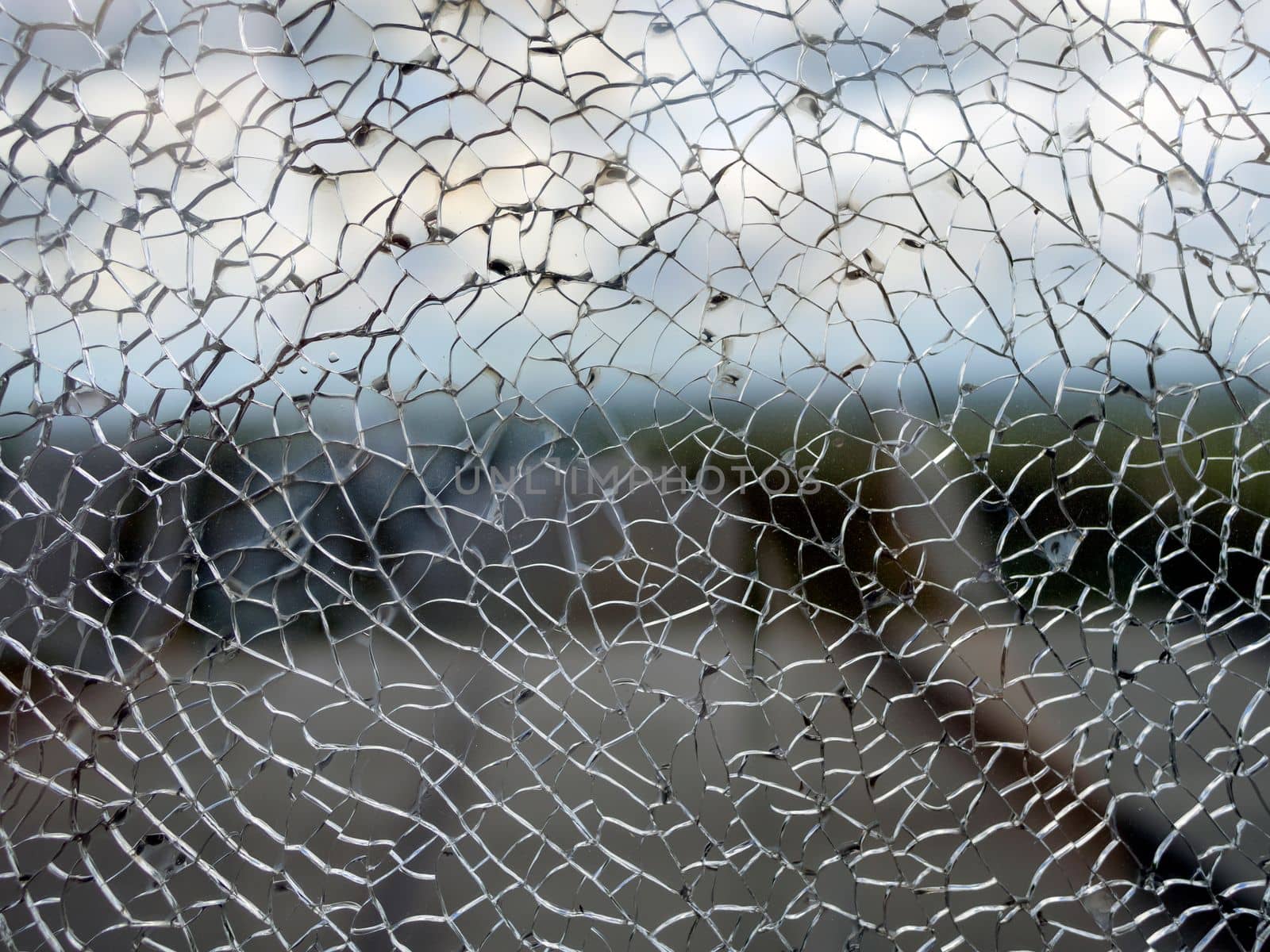 Useful texture overlay. A broken glass on. with many sharp shards. Useful texture overlay for background.