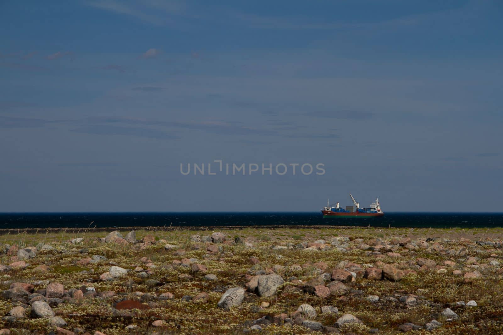 Fuel barge or tanker ship off the coast of Hudson Bay waiting to provide fuel for an arctic community by Granchinho