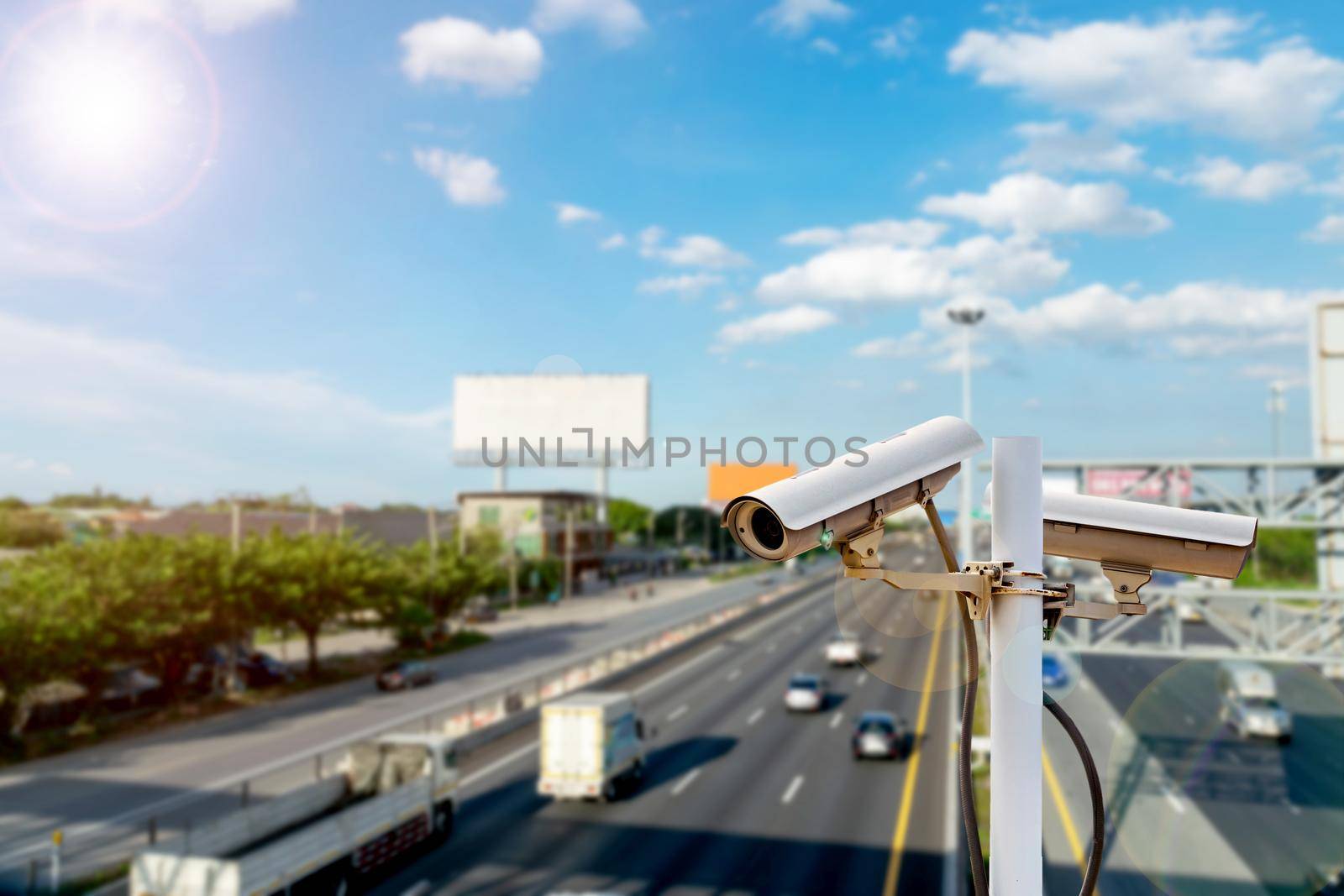CCTV cameras on the overpass for recording on the road for safety and traffic violations. by wattanaphob