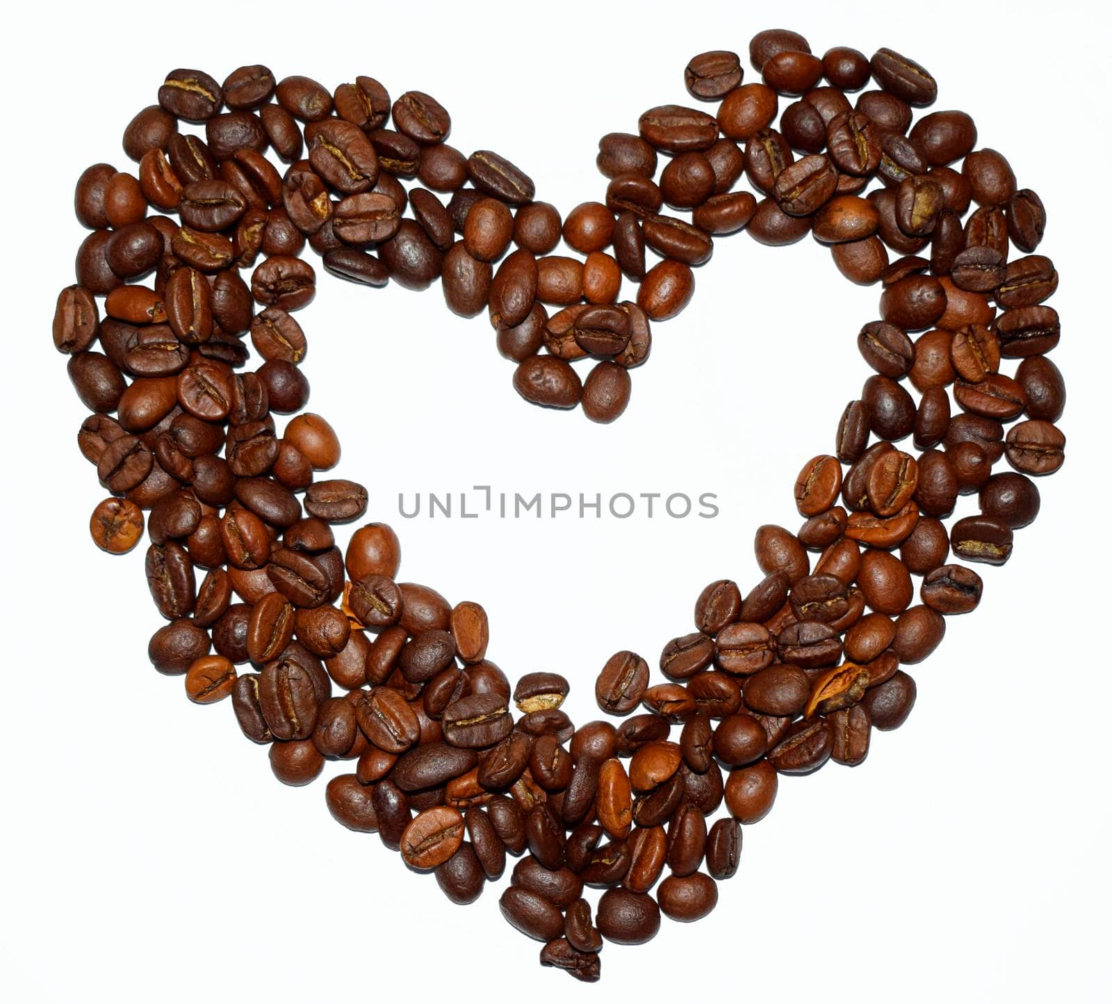 heart shaped roasted coffee beans isolated on a white background