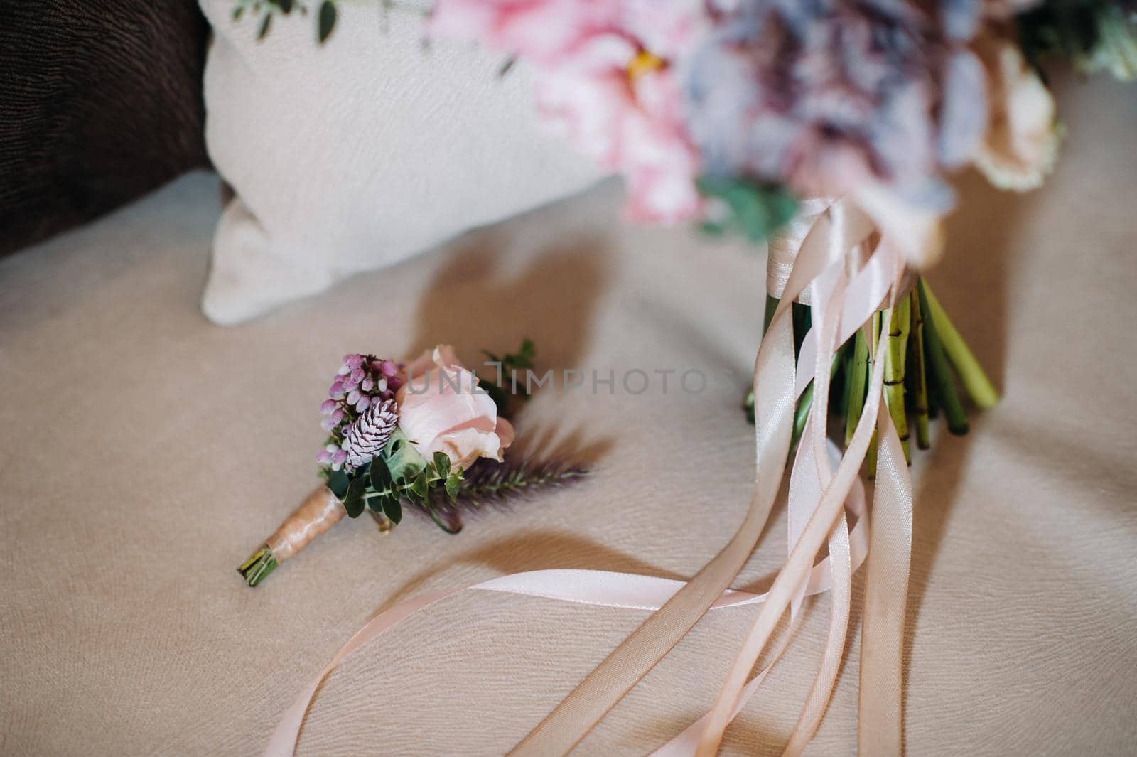 wedding bouquet with roses and boutonniere.The decor at the wedding.