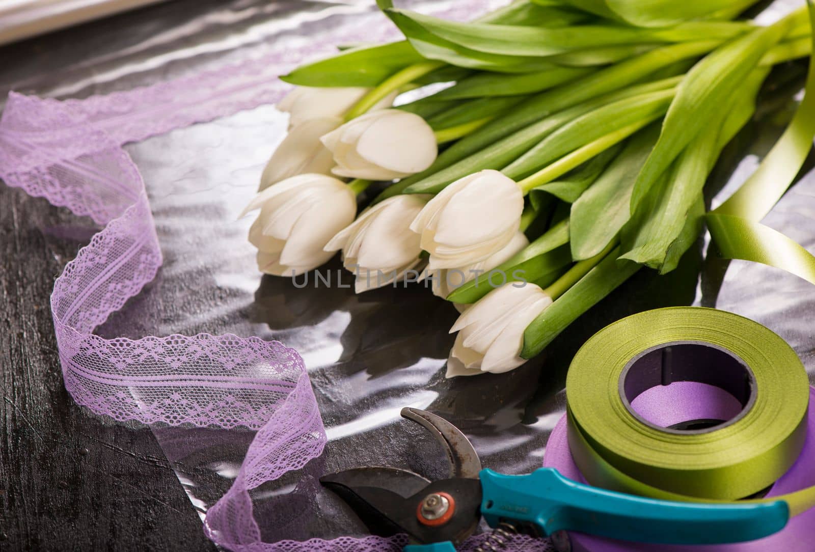 image of holiday gift packaging. sale and packaging of flowers. Bouquet of white tulips by aprilphoto