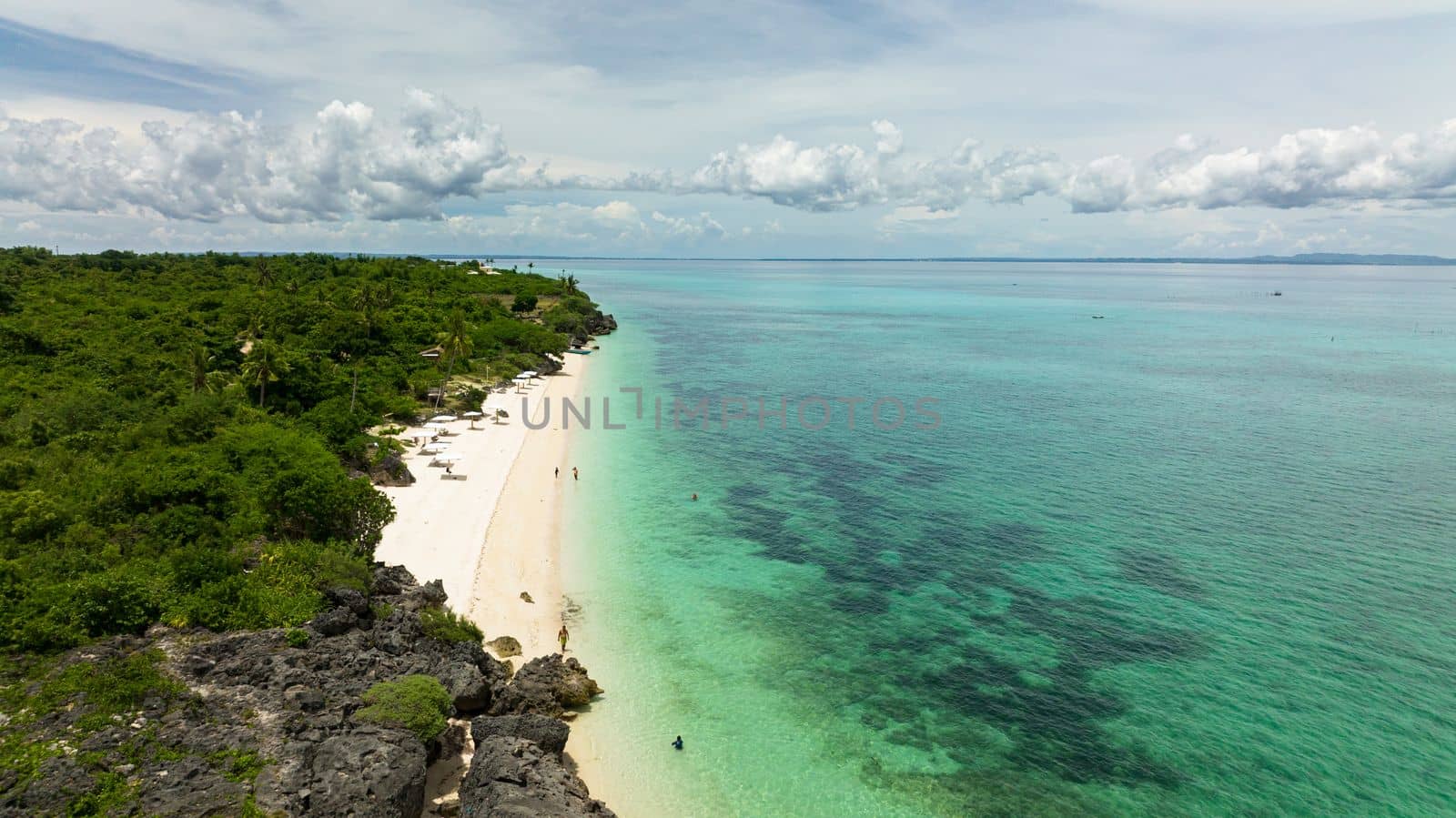 Aerial view of tropical sandy beach and blue sea. Bantayan island, Philippines.