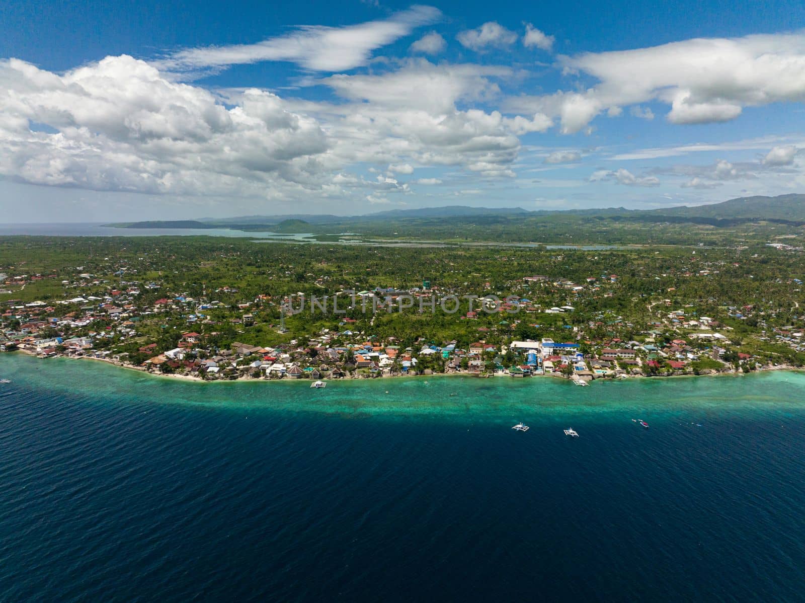 Coastline with coral reef and blue water, diving site, Moalboal, Philippines.Cebu.