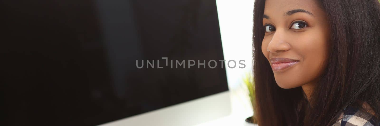 Black business woman holding phone making notes in modern office. Mobile apps fucking business concept