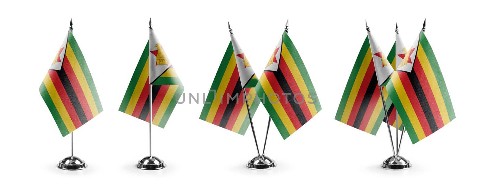 Small national flags of the Zimbabwe on a white background.