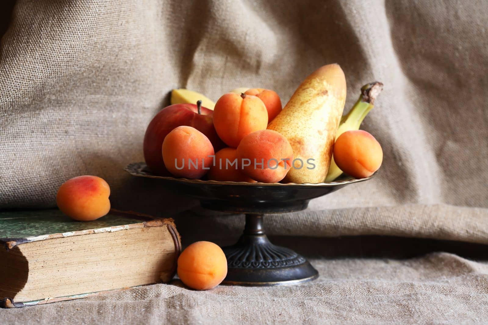 Heap of freshness fruits in  bowl againast nice gray canvas background