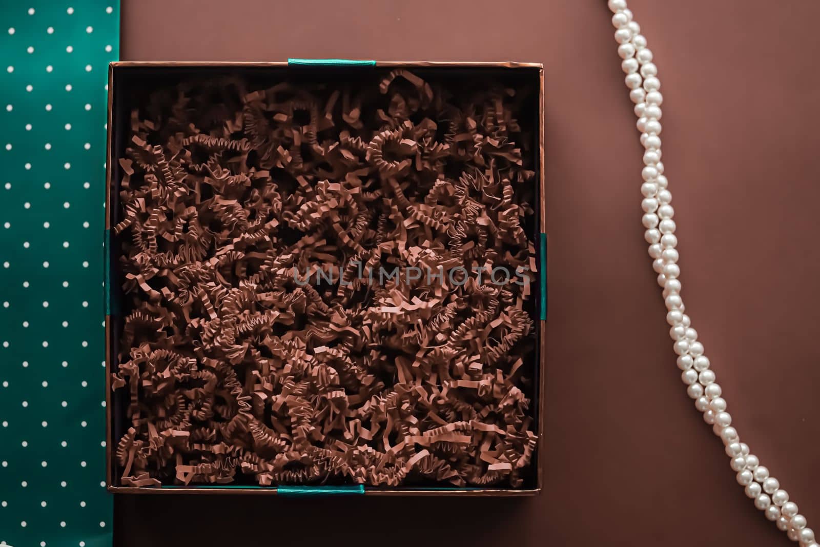Holiday gift, pearl jewellery necklace and beauty box subscription package mockup for luxury present, empty open gift box flat lay on chocolate background as online shopping delivery, flatlay.