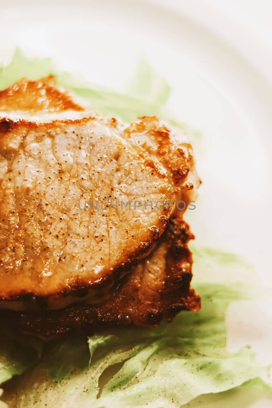 Food and diet, fried pork fillet with lettuce as meal for lunch or dinner, tasty recipe by Anneleven