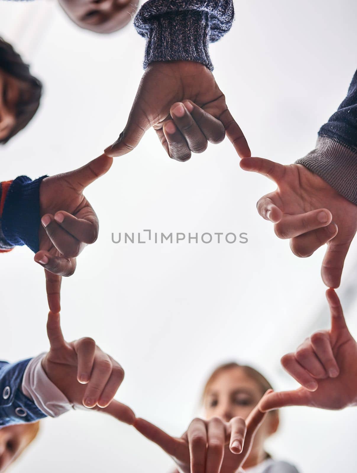 We can do a lot when we are united. young kids playing together outdoors. by YuriArcurs