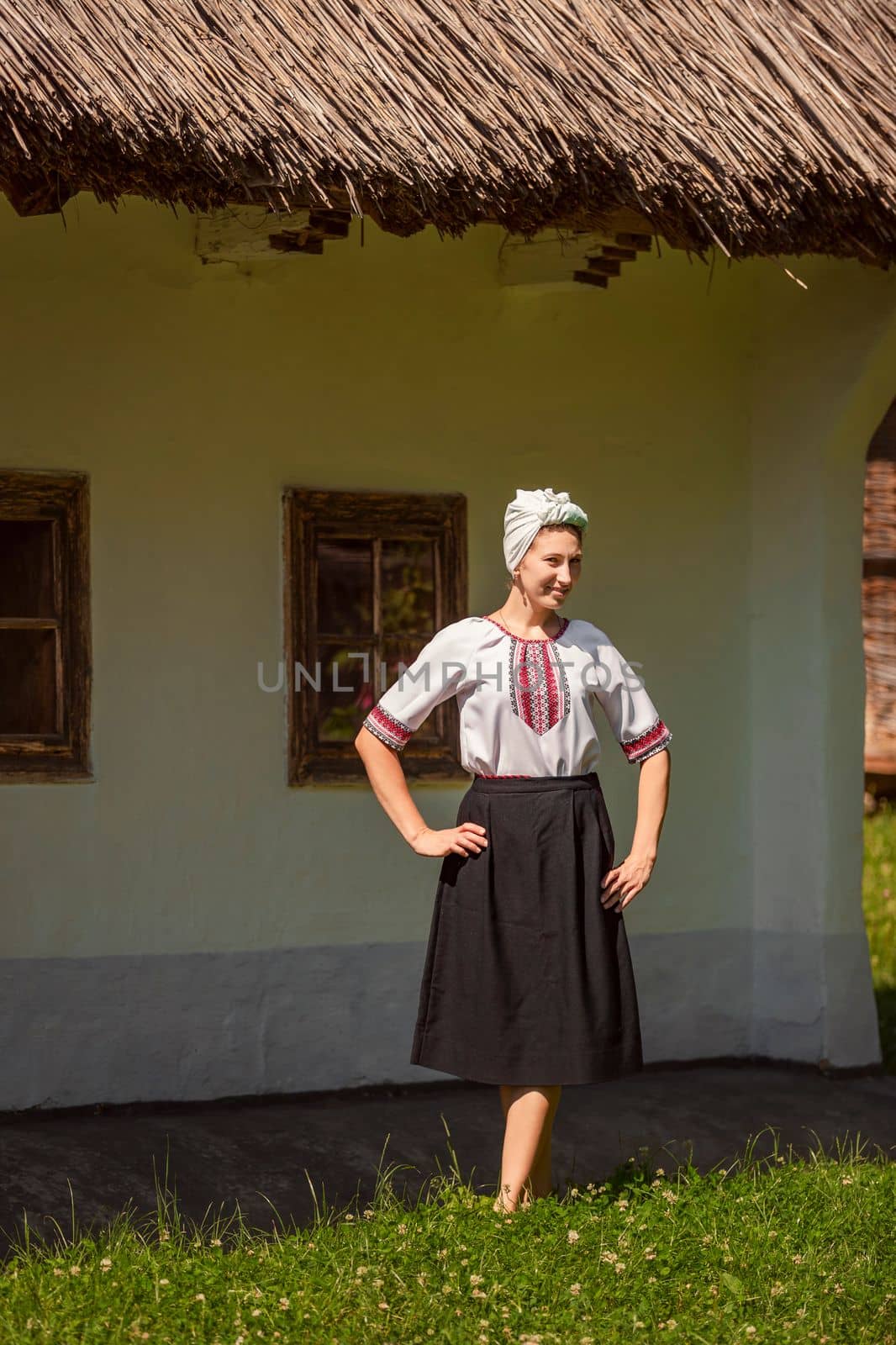 young woman in ukrainian national costume outdoors