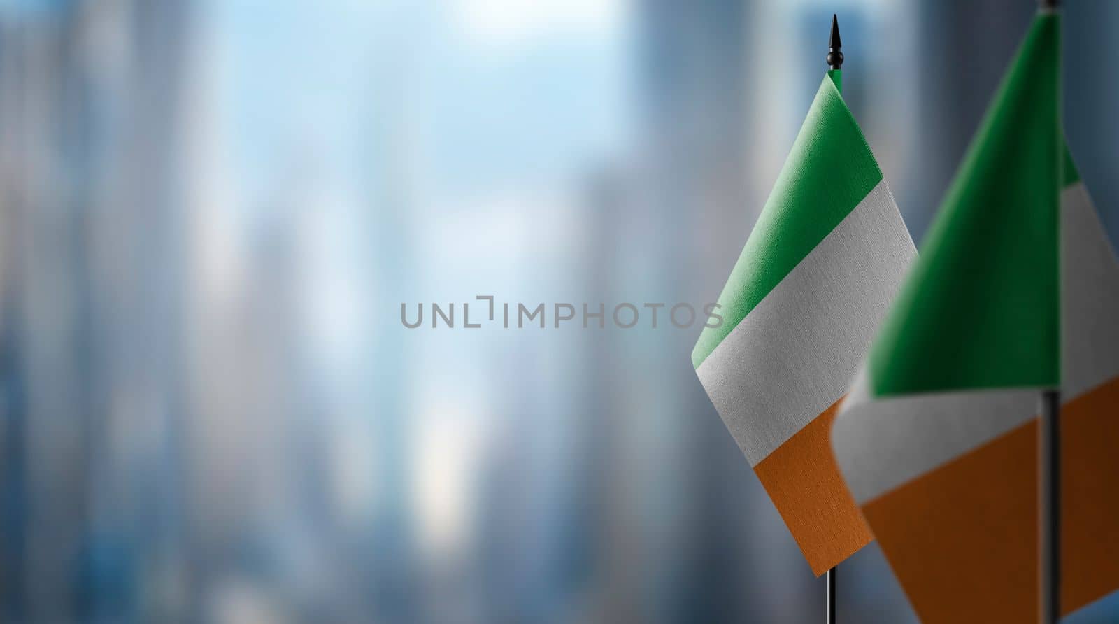 Small flags of the Ireland on an abstract blurry background by butenkow