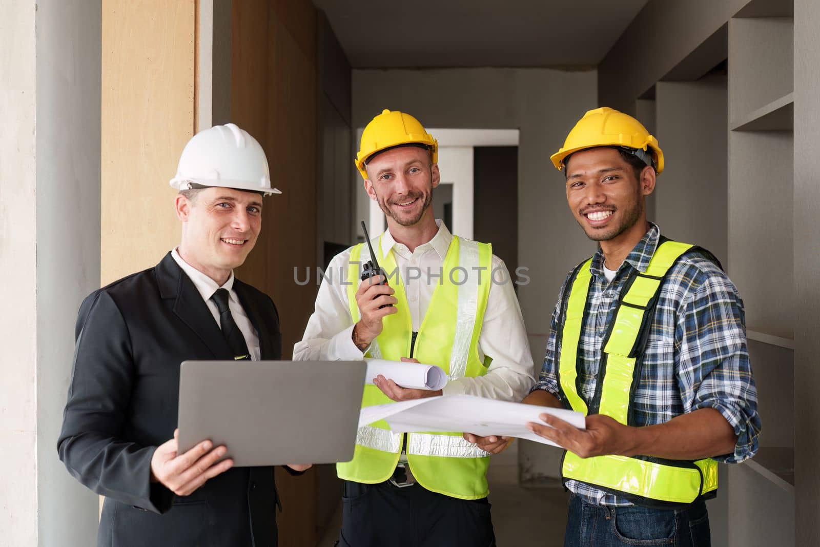 Civil Construction team working at renovate construction site. architectural plan, engineer sketching a construction project, green energy concept