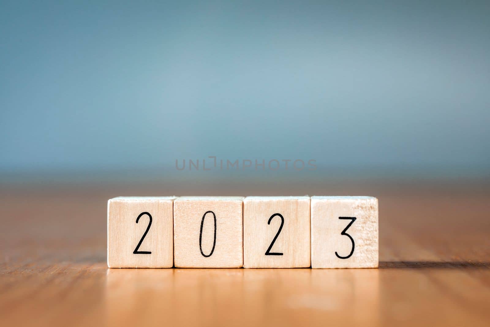 2023 New Year. wooden blocks 2023 on blue background. Start new year 2023 with goal plan, goal concept, action plan, strategy, new year business vision. copy space by Annebel146
