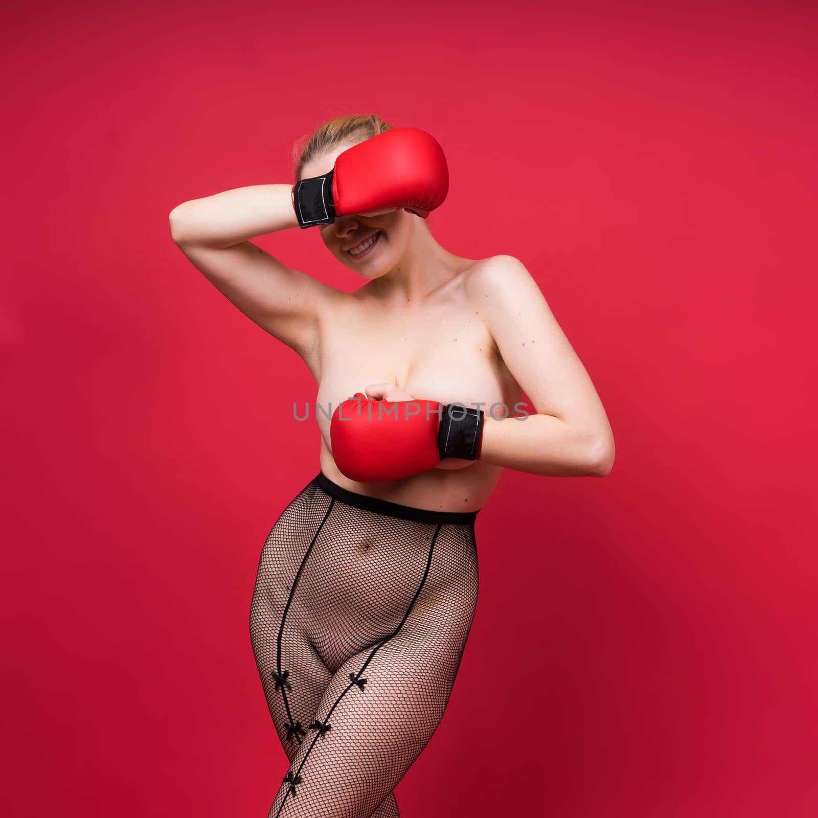 Boxer, seductive confident female boxer with gloves studio, sporty woman posing looking at camera. by Zelenin