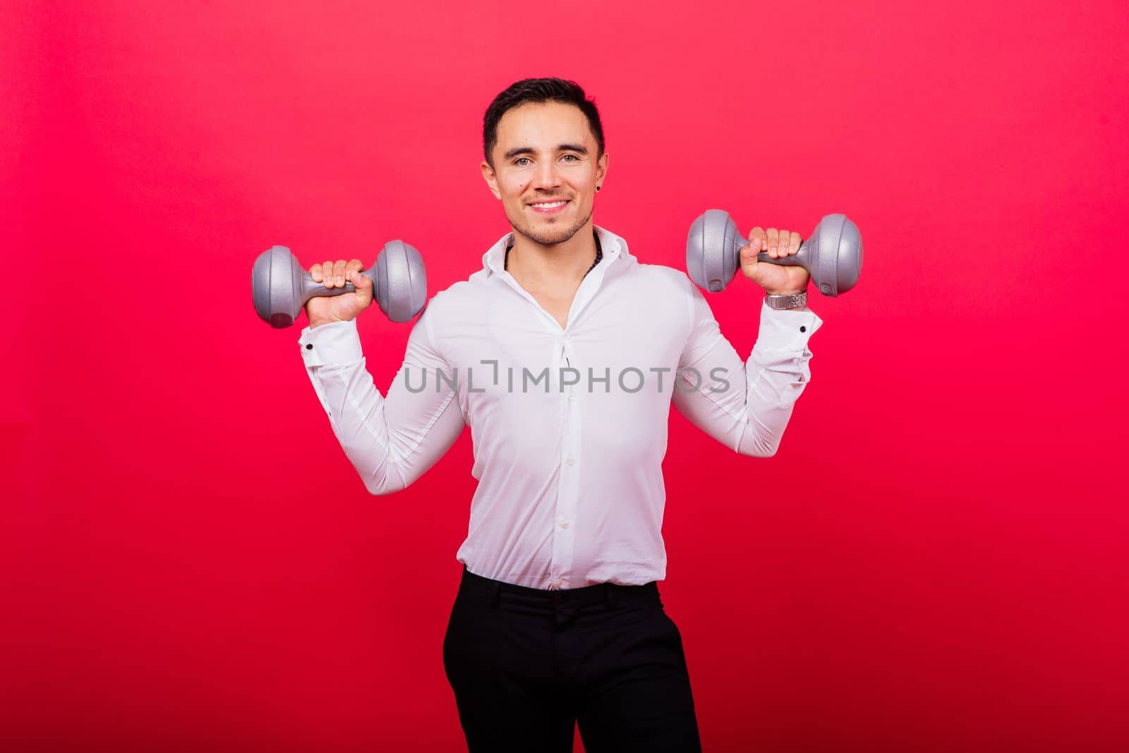 Portrait young fitness sporty strong man barechested muscular sportsman isolated on grey dark.