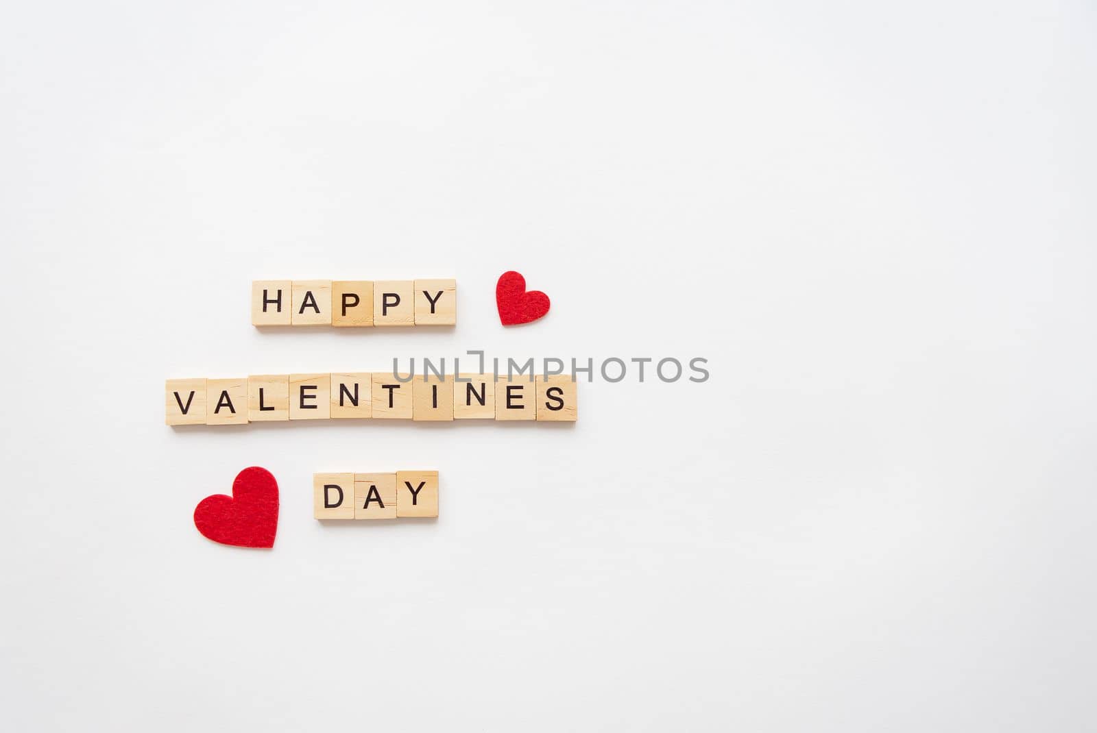 Postcard Happy Valentine's Day. Wooden lettering Happy Valentine's Day. Red heart on a white background