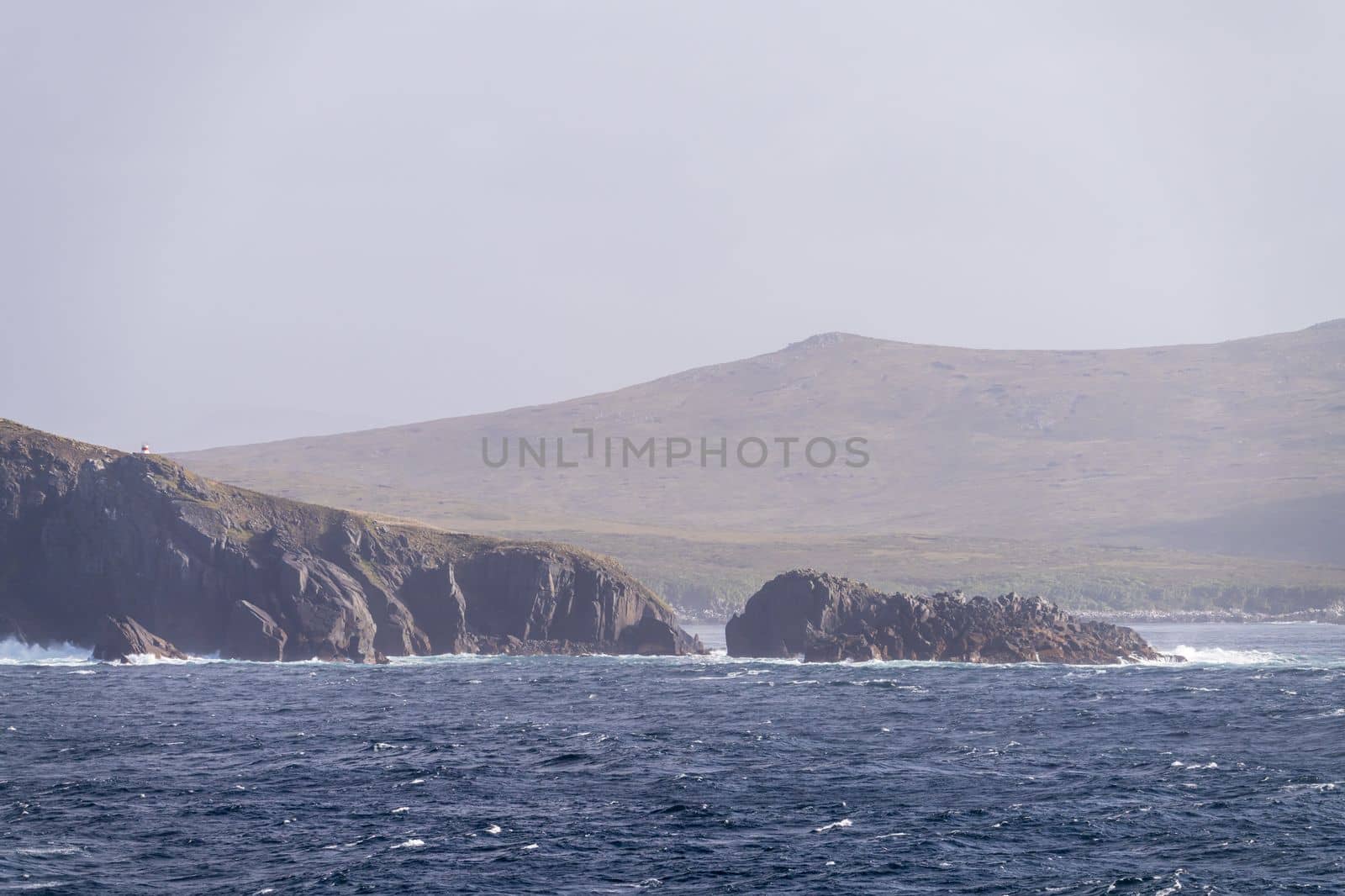 Automated lighthouse on cliffs by Cape Horn is southermost warning light